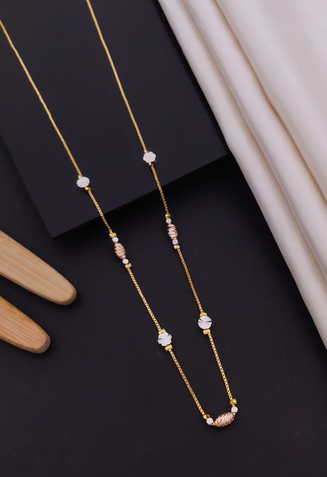Elegant Tri-Tone Floral & Diamond-Cut Disc Station Gold Mangalsutra