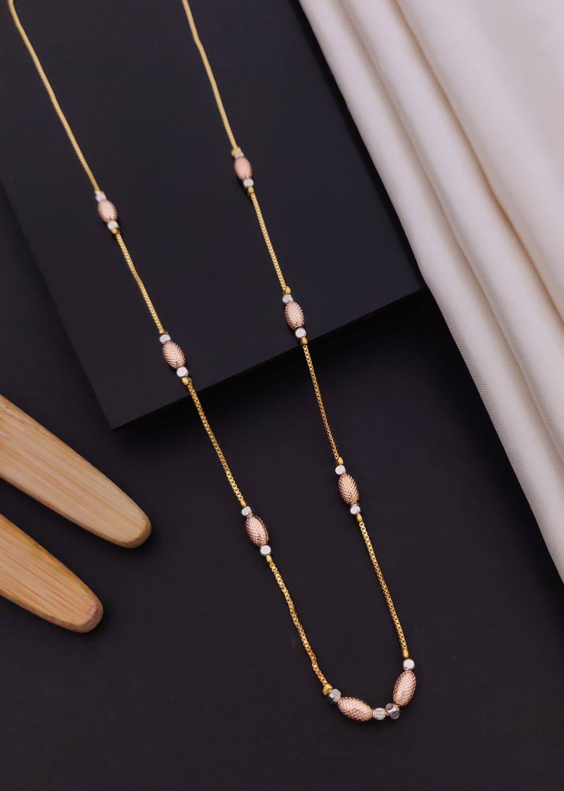 Elegant Tri-Tone Textured Oval Station Gold Mangalsutra